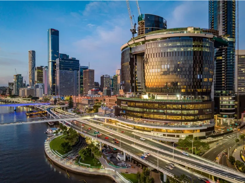 Brisbane riverfront cityscape featuring urban infrastructure, bridges, and commercial developments