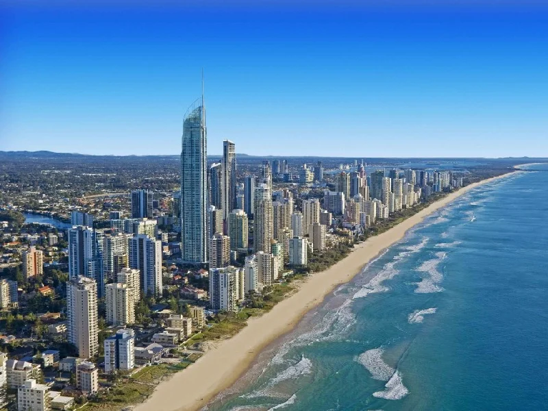 Aerial view of the Gold Coast skyline featuring coastal development, high-rise buildings, and beachfront infrastructure